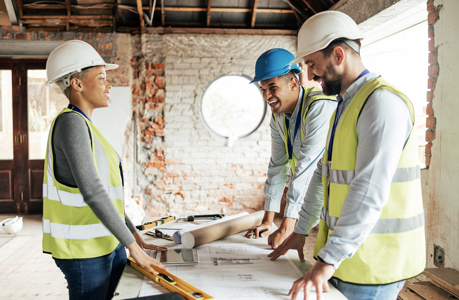 construction-team-planning-a-building-blueprint-pr-2023-01-04-19-48-04-utcWeb